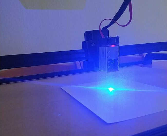 Laser draws tactile graphics on heat-sensitive paper